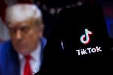 August 1, 2020, Brazil. In this photo illustration the TikTok logo seen displayed on a smartphone. United States President Donald Trump appears in the background. He said he will ban TikTok in the USA