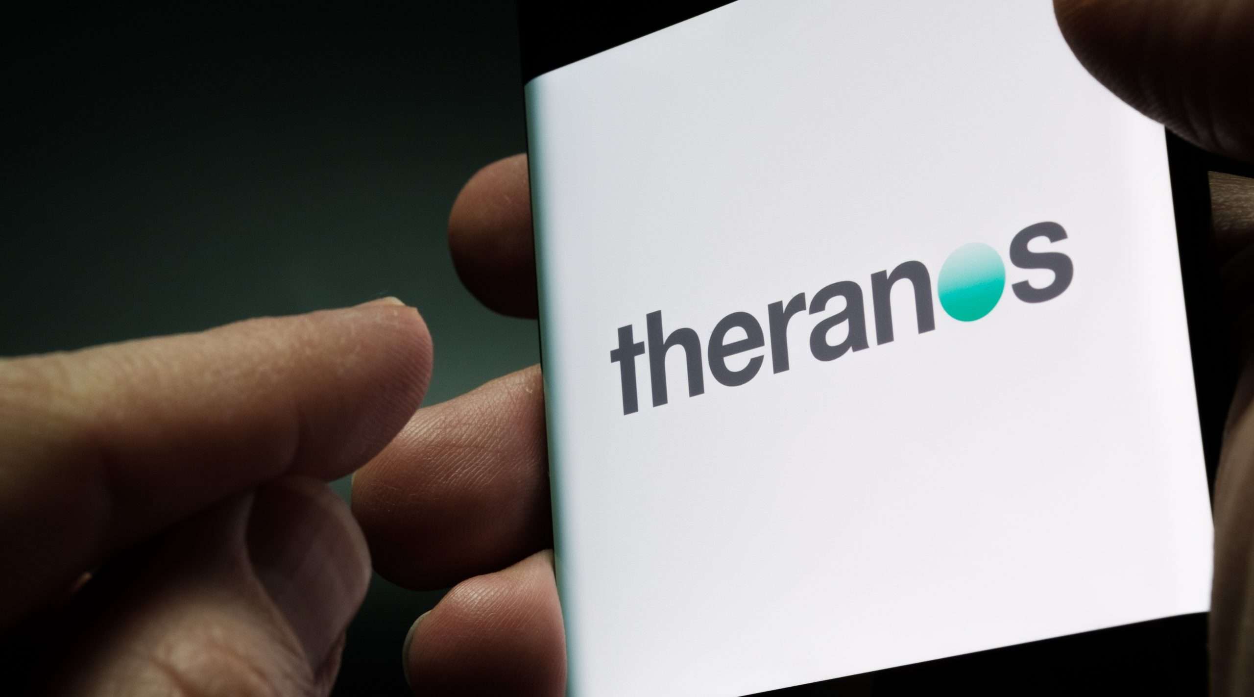Theranos,Company,Logo,Seen,On,Smartphone,Screen,Hold,In,Hand.