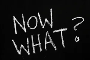 The,Question,Now,What?,Written,By,Hand,In,White,Chalk